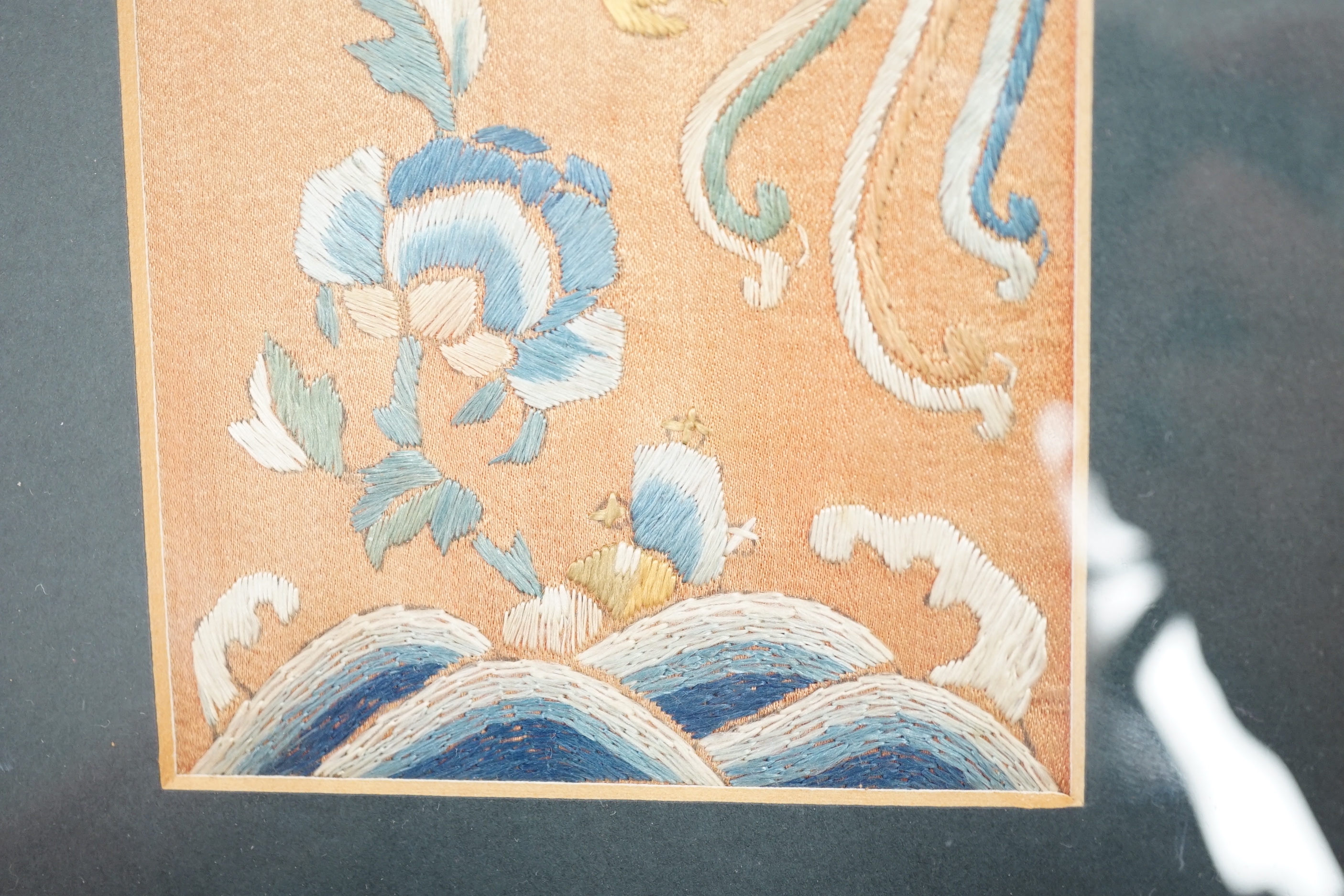Two Chinese hardwood and mixed soapstone panels and a silk embroidered panel, largest 14.5cm x 29.5cm high